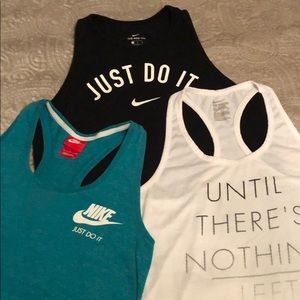Group of three Nike tank tops.
